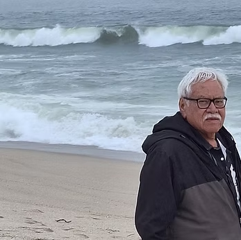 Artist walking on a winter beach